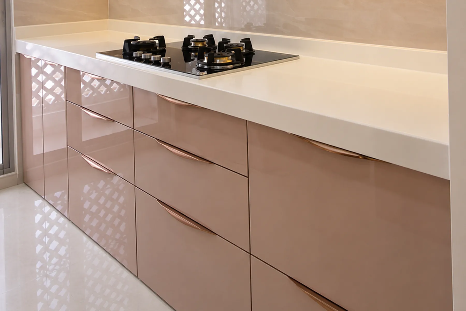 Rose Gold Handle Profiles on Glossy Kitchen Drawers